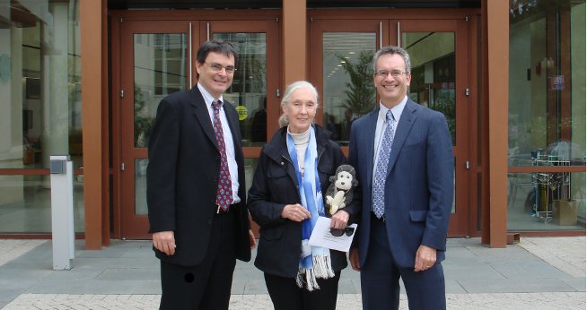 Professor Ken Conca (l) and Dean James Goldgeier flank activist Jane Goodall.